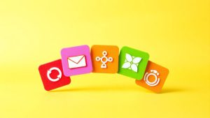 Five promotional strategy icons in a dynamic arrangement.